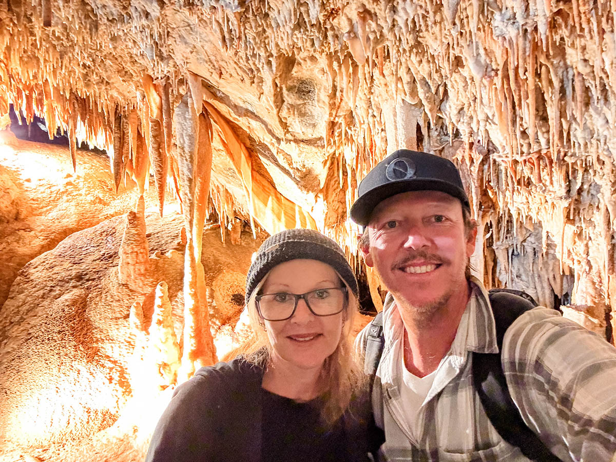 Brett and Julie from 2 Foodies Travel in the Lucas Cave at Janolan Caves in the Blue Mountains.