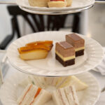 Raffles High Tea Platter with three tiers of food, white china.